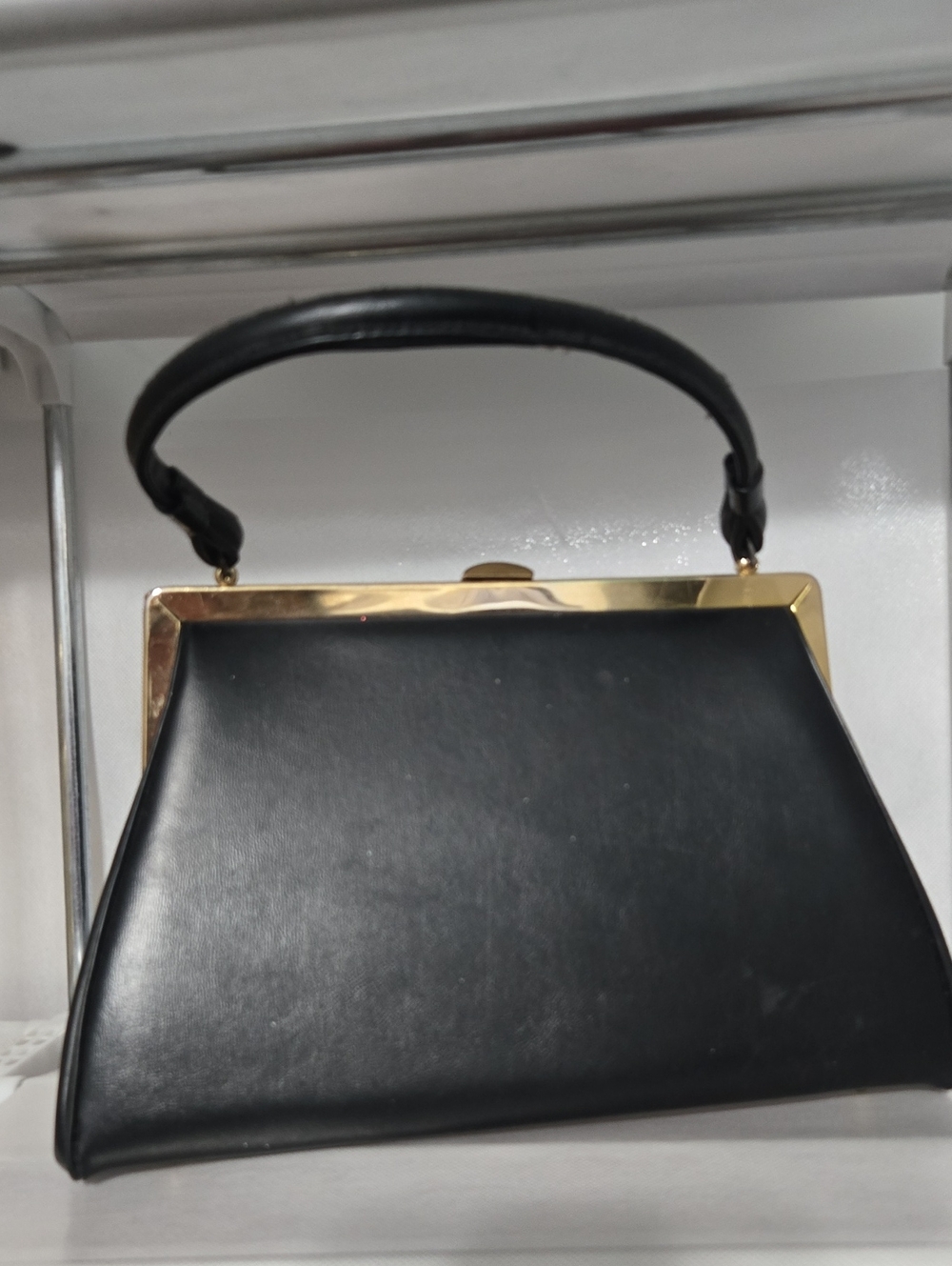 Structured Black Leather Frame Wristlet with Gold Accent